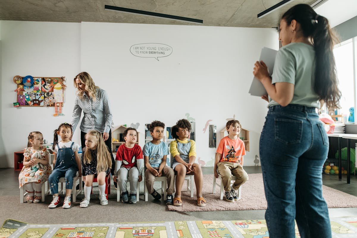 Bright preschool classroom with diverse children and educators